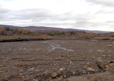 Heavy equipment works on flattening / grading large area of dirt