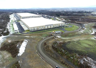 Aerial view of two large warehouses in operation