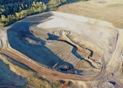 Aerial view of site under reclamation with pit to be filled in in middle.