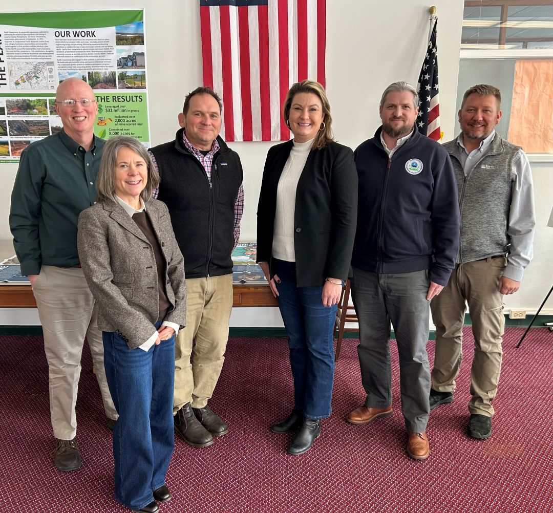 20260210-ec-hosts-usepa-r3 Aerial landscape view of two man-made ponds and several banks of coal waste in forested, mountain area