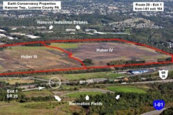 Marked up aerial image of flat piece of land, with line separating site in half; left side is Huber III, right side is Huber IV
